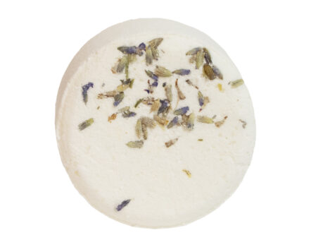 White circular bath bomb with lavender buds