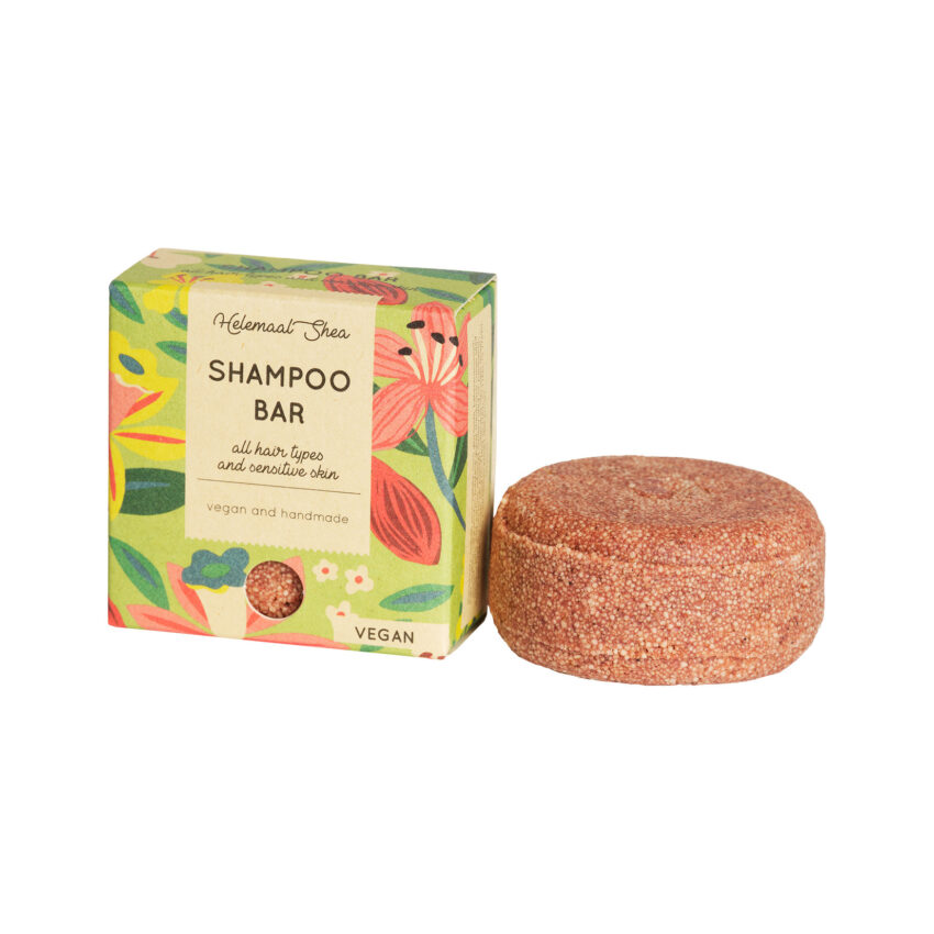 Tropisch gekleurde doos met bruine shampoobar ernaast.