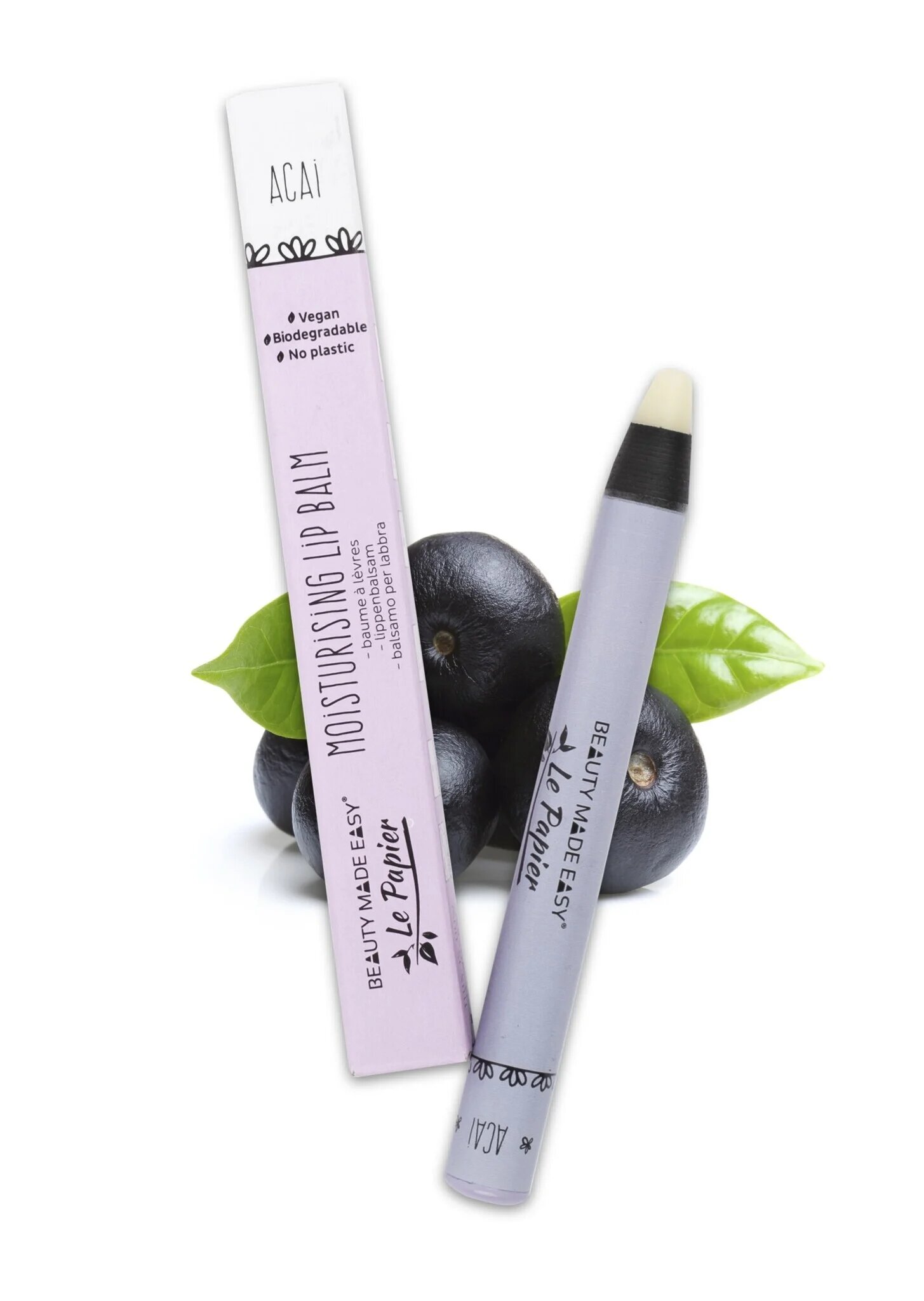 Image of Beauty Made Easy's Acai Moisturizing Lip Balm in biodegradable packaging, highlighting vegan and plastic-free attributes, with acai berries and a green leaf in the background