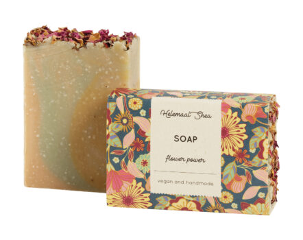 earth tone bar of HeleamaalShea's Flower Power soap next to a floral cardboard box