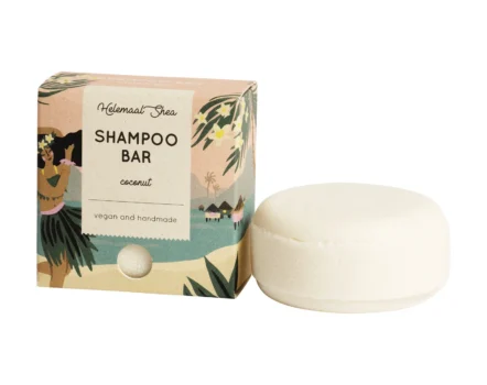 Light colored cardboard box next to white coconut shampoo bar from HelemaalShea