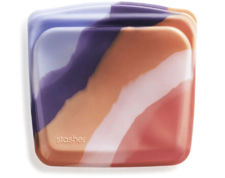 Stasher Sandwich reusable silicone storage bag in orange and purple wave pattern