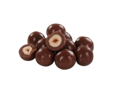 A close-up of whole roasted hazelnuts and hazelnuts coated in glossy oat milk chocolate, displayed on a white background. The chocolate-covered hazelnuts have a smooth, shiny surface, while the plain hazelnuts are lightly toasted.