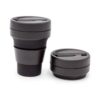 Two Stojo Pocket Cups in Ink (355ml), one fully expanded and the other collapsed, showing the reusable coffee cup’s compact design.