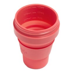A fully opened Stojo Pocket Cup in Coral (355ml) with its lid removed, showcasing interior measurement markings.